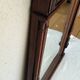 Henri II trumeau mirror for a fireplace in solid walnut.