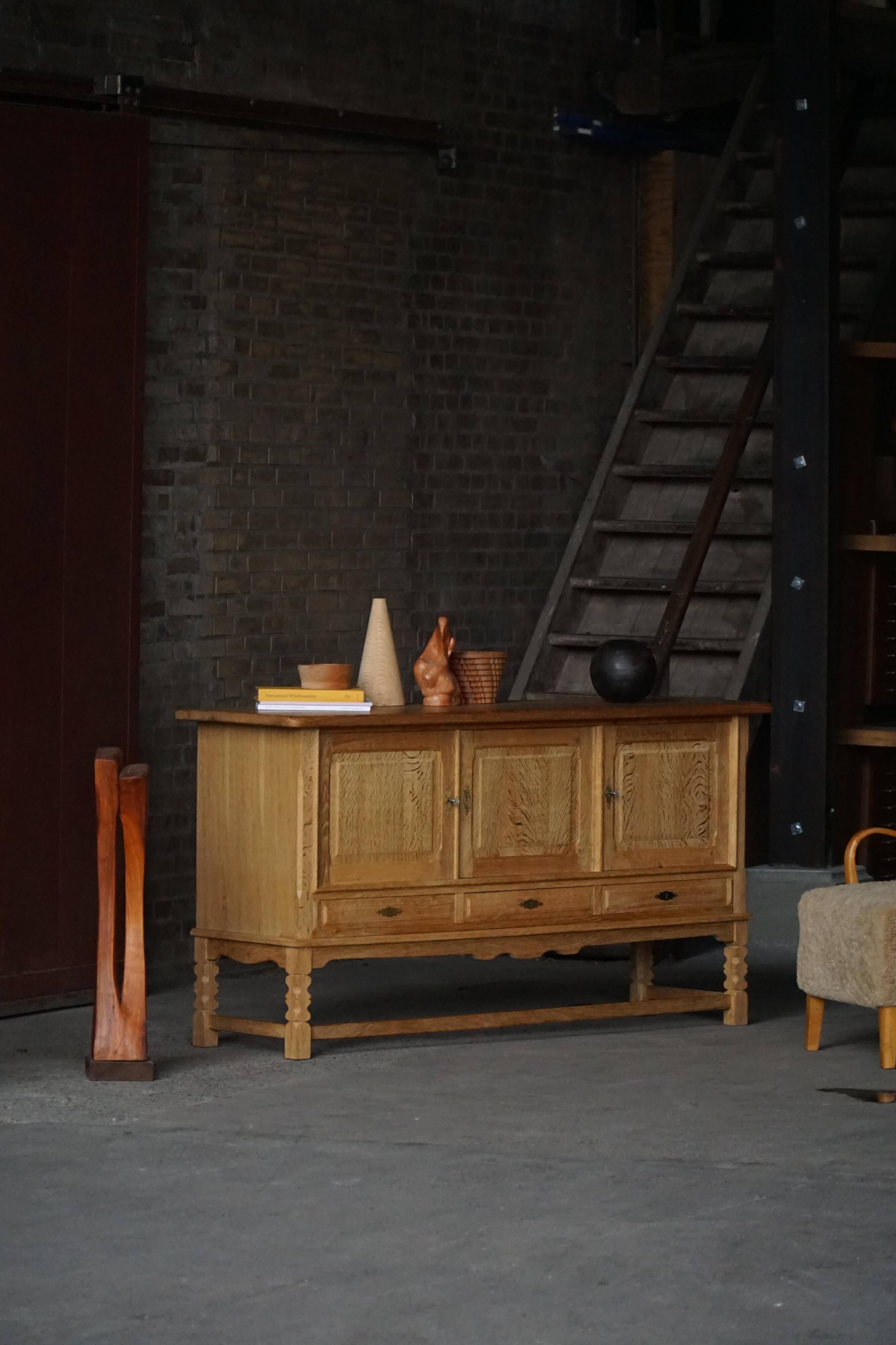 Brutalist Danish enfilade from the mid-century in oak by Henning Kjærnulf, 1960s.