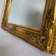 Miroir biseauté style empire doré 74x64cm