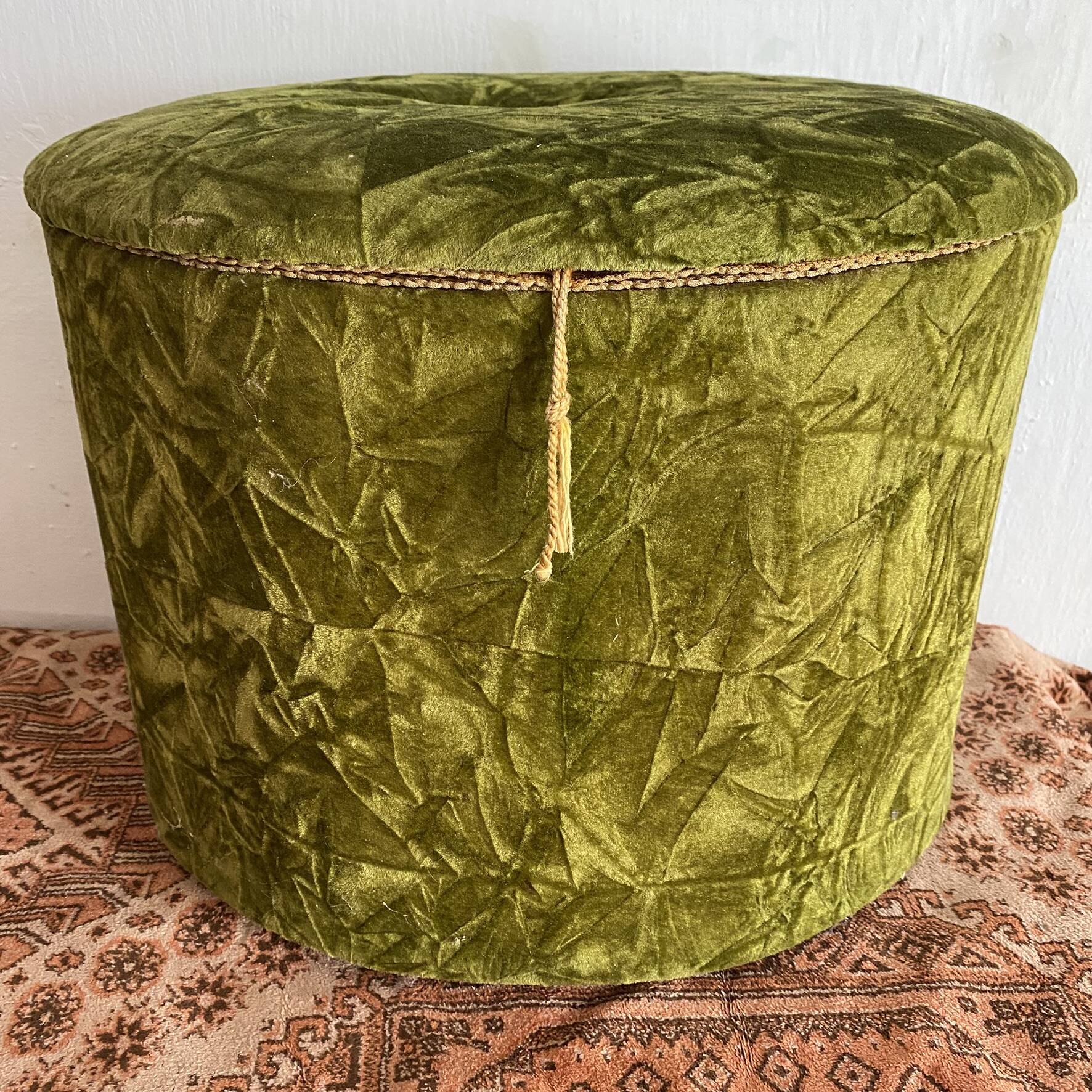 Green velvet storage pouffe from the 1960s.