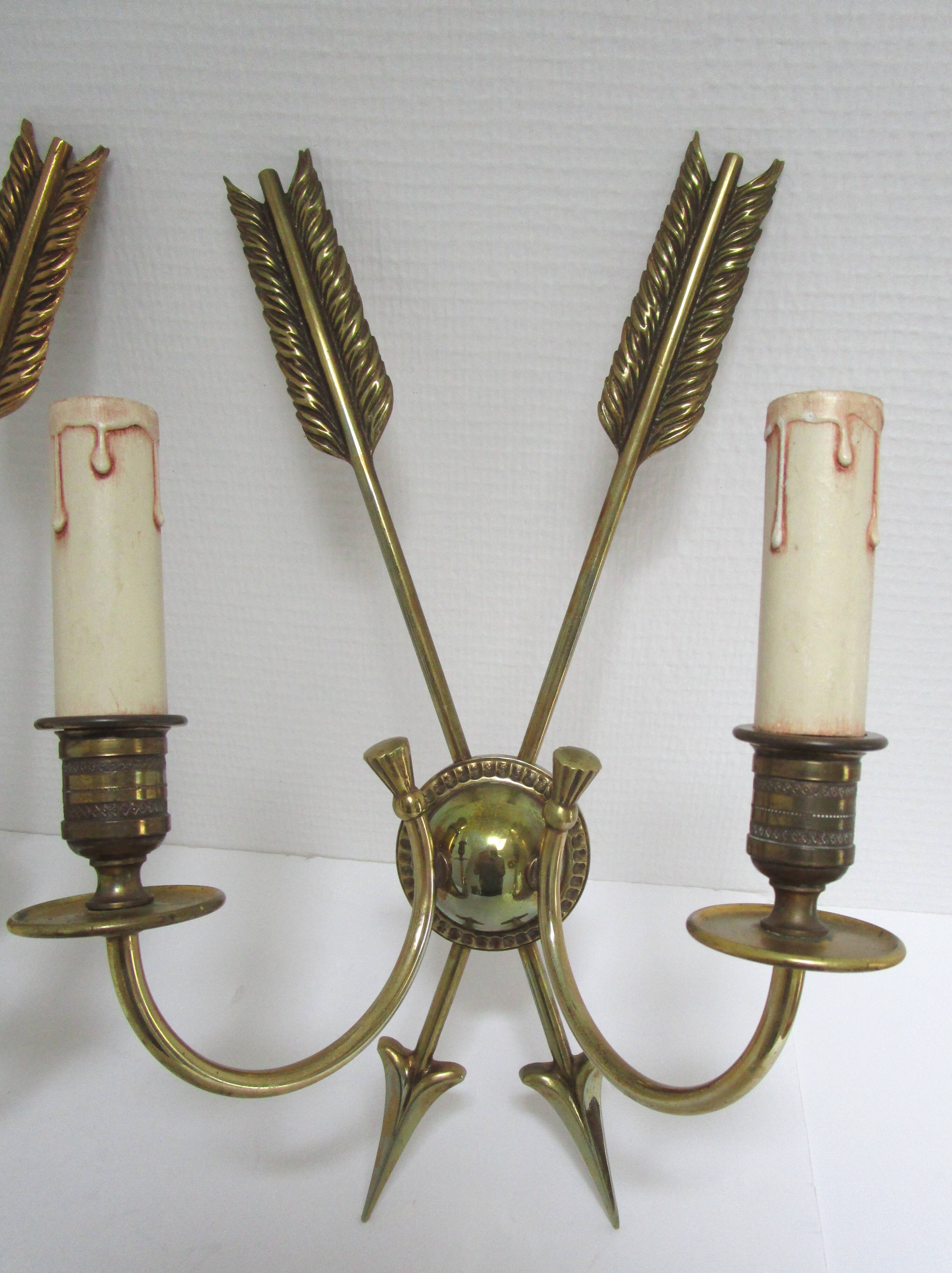 Pair of bronze crossed arrow wall lights Lucien Gau