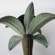 Antique palm tree-shaped candlestick in patinated metal