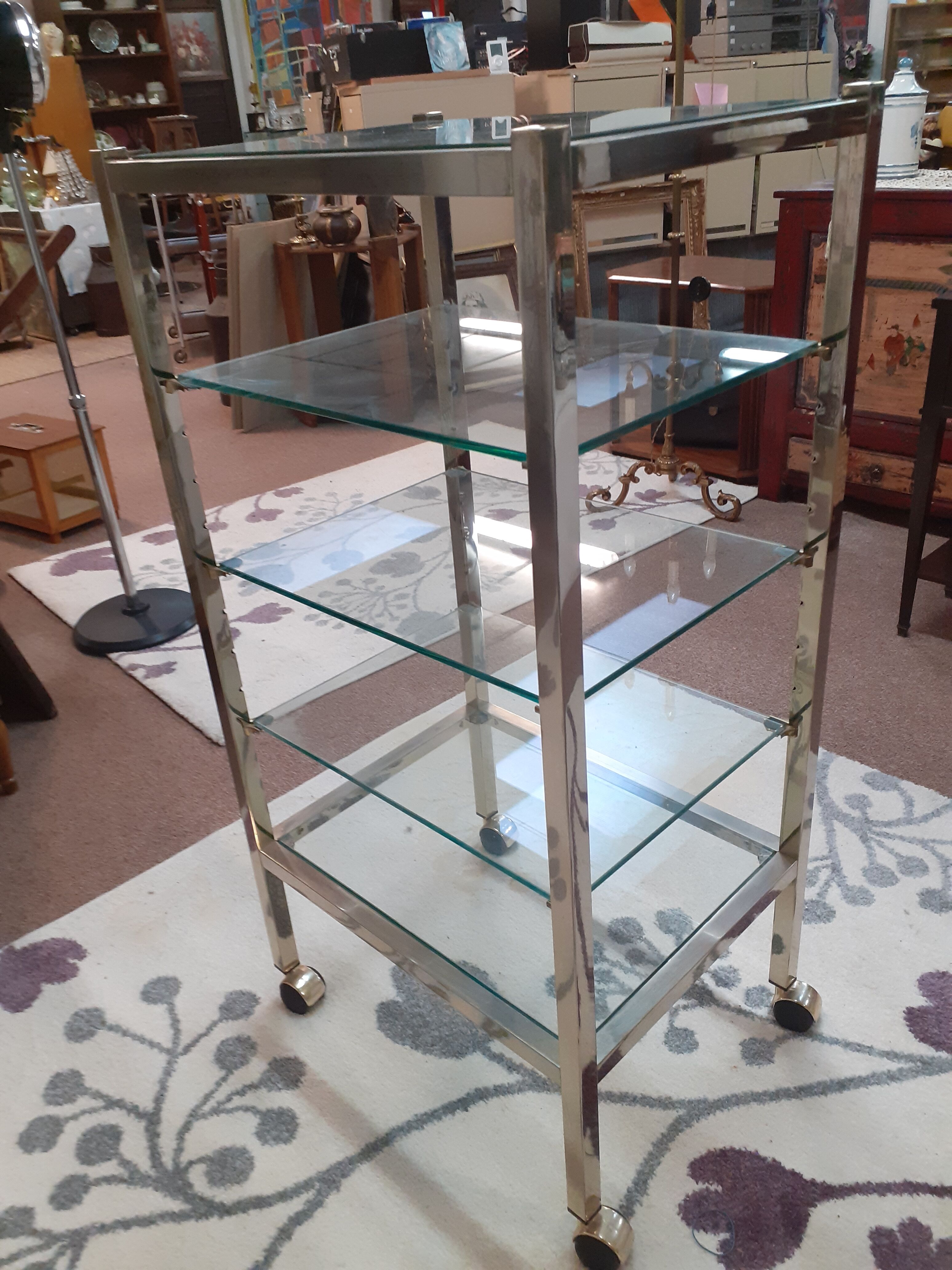 Glass and brass shelf on wheels