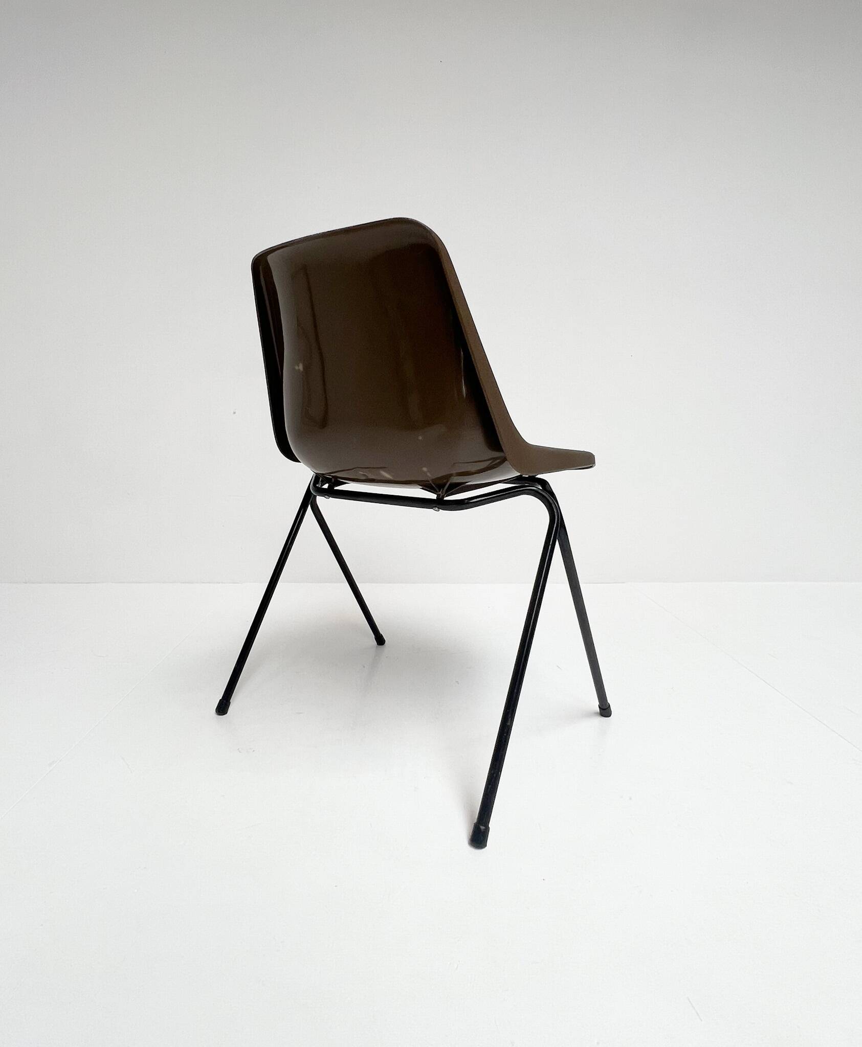 Brown and black set of 6 Polyprop chairs on a metal frame. The Polyprop cha