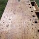 Old solid wood carpenter's bench with 2 functional vices.
