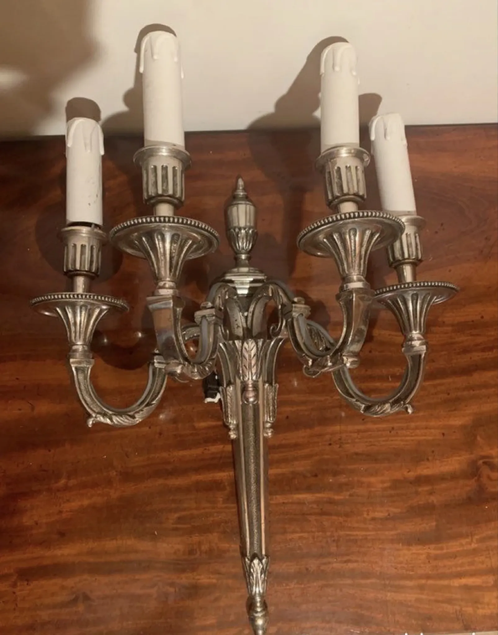Bronze and silver wall sconce