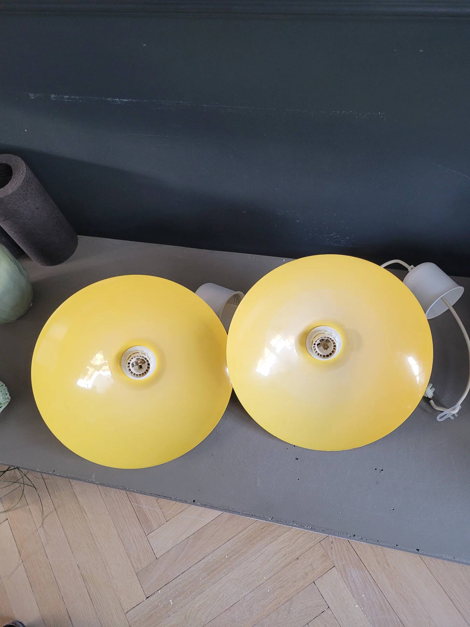 Pair of yellow lacquered metal pendant lights