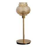 Table lamp with a textured antique globe and a golden base