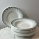 Set of 12 deep plates Saint Amand with floral garland decoration.