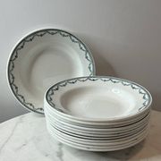 Set of 12 deep plates Saint Amand with floral garland decoration.