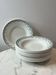 Set of 12 deep plates Saint Amand with floral garland decoration.