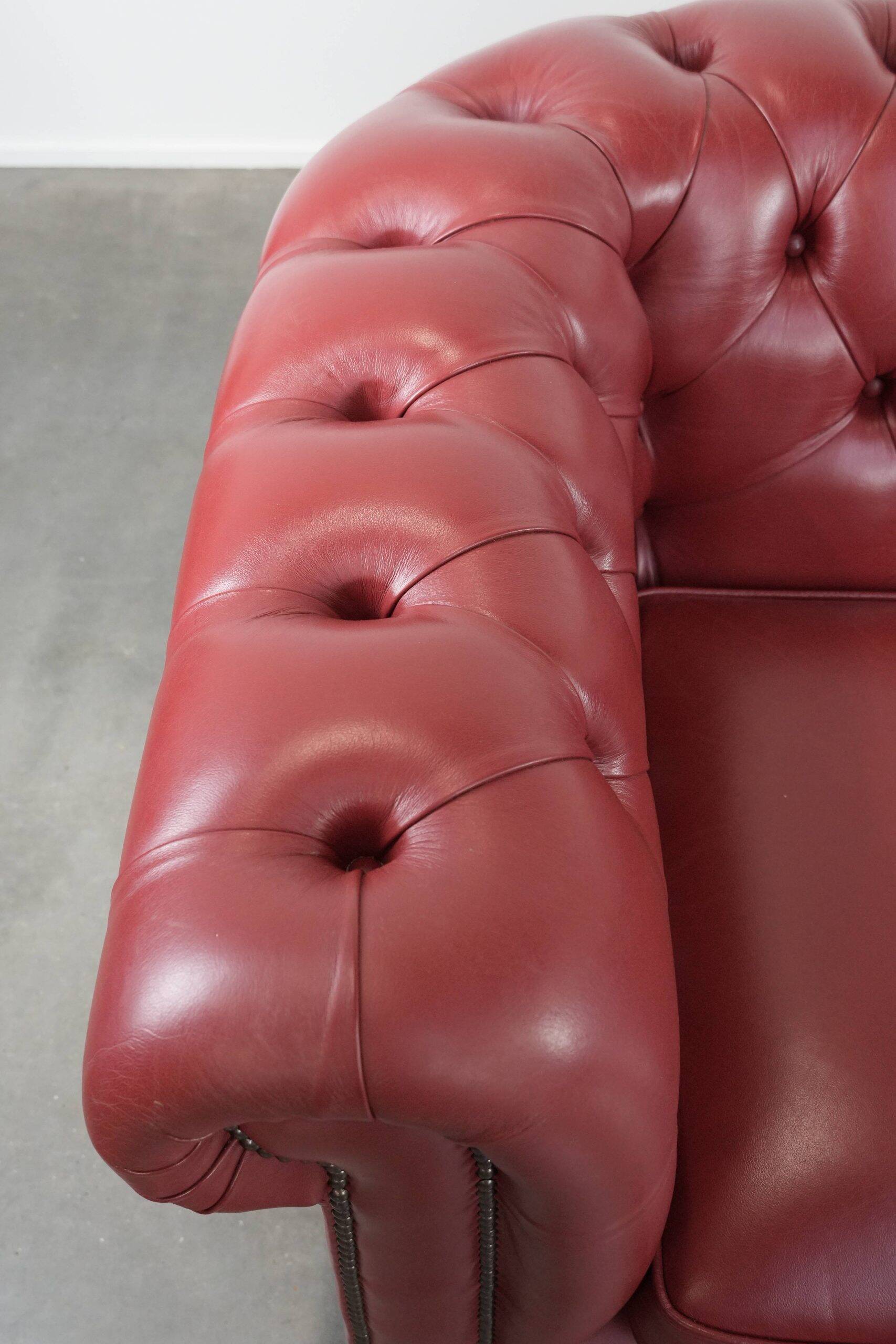 English cowhide Chesterfield 2.5-seater sofa in a stunning red colour