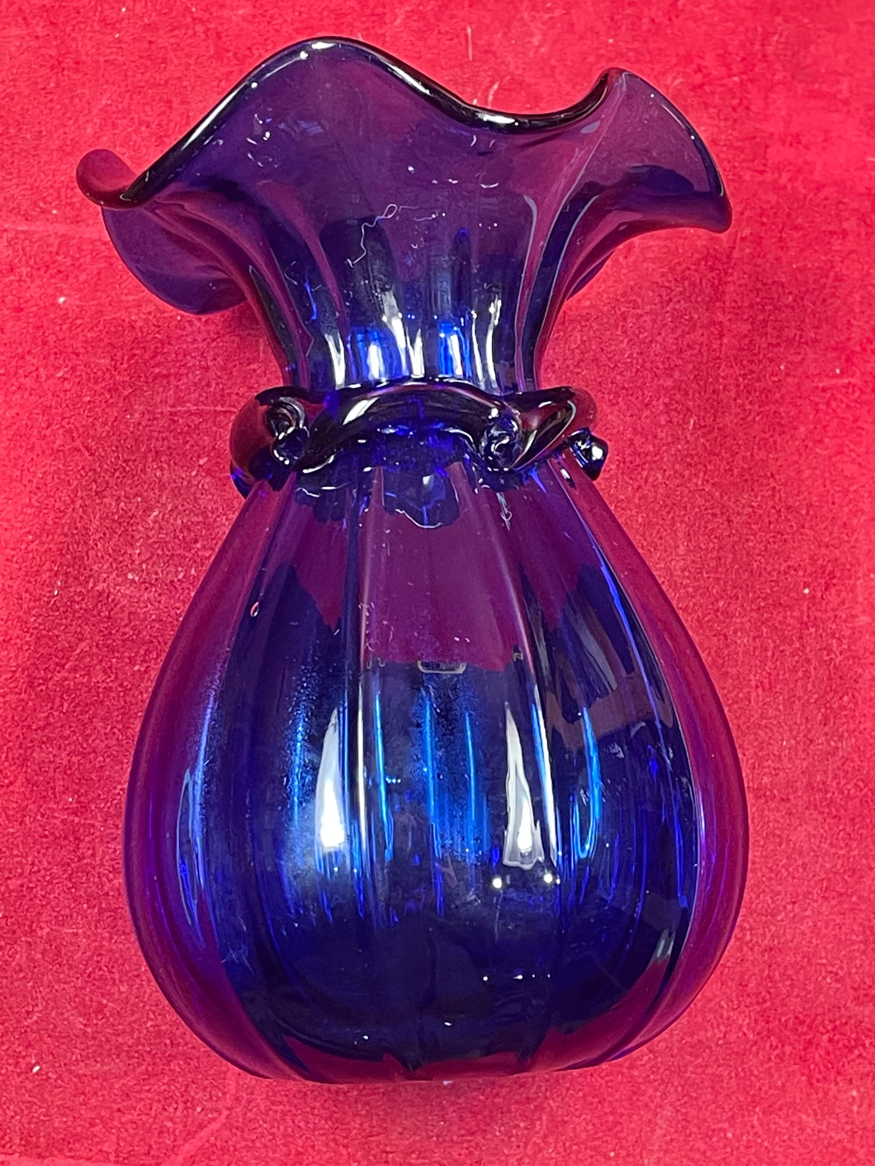 Series of 3 blue glass vases in the shape of a purse, 11, 13 and 17 cm
