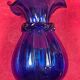 Series of 3 blue glass vases in the shape of a purse, 11, 13 and 17 cm