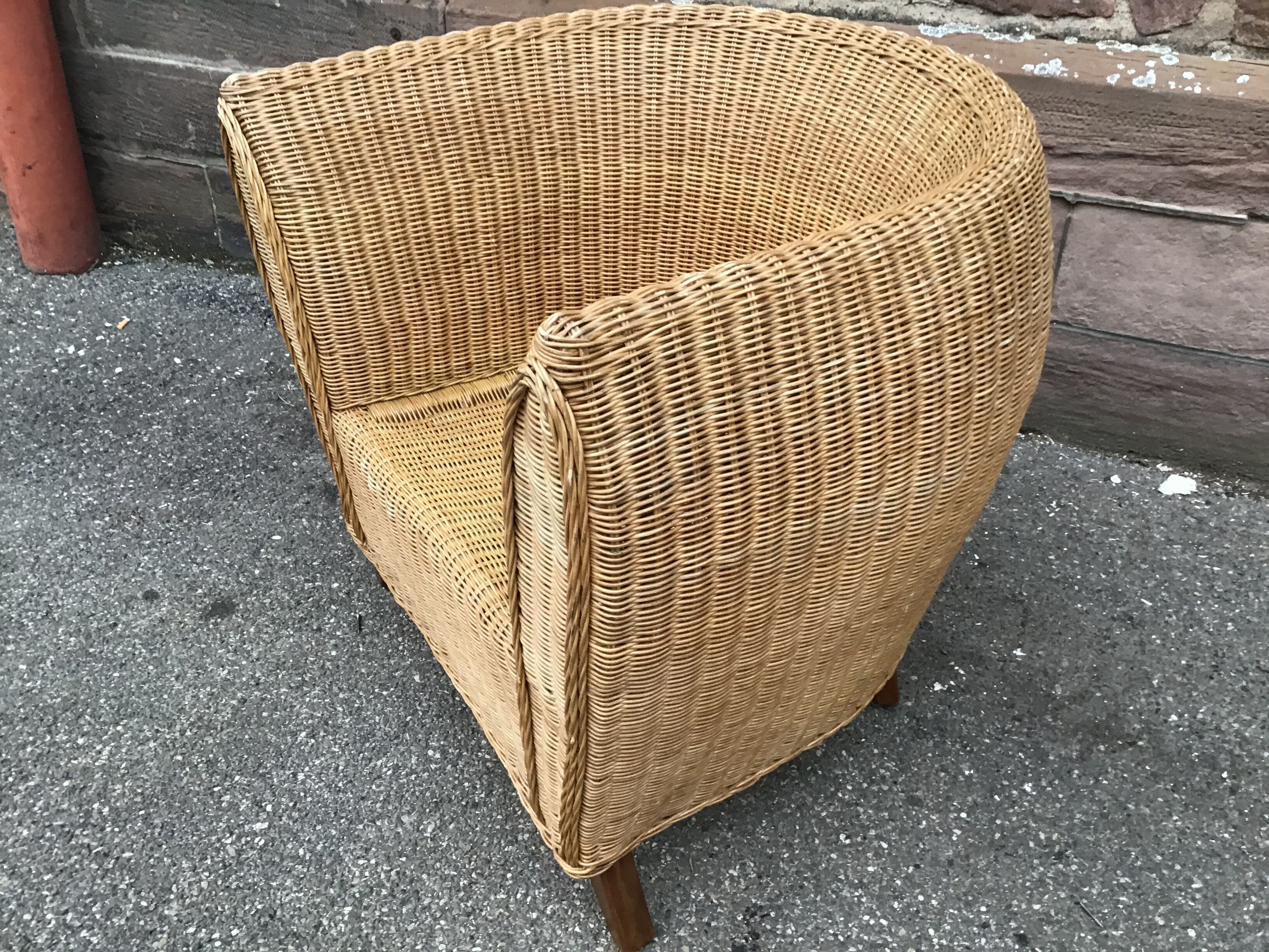 Vintage gondola armchair in rattan 1980