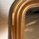 Rounded rectangular mirror in gold