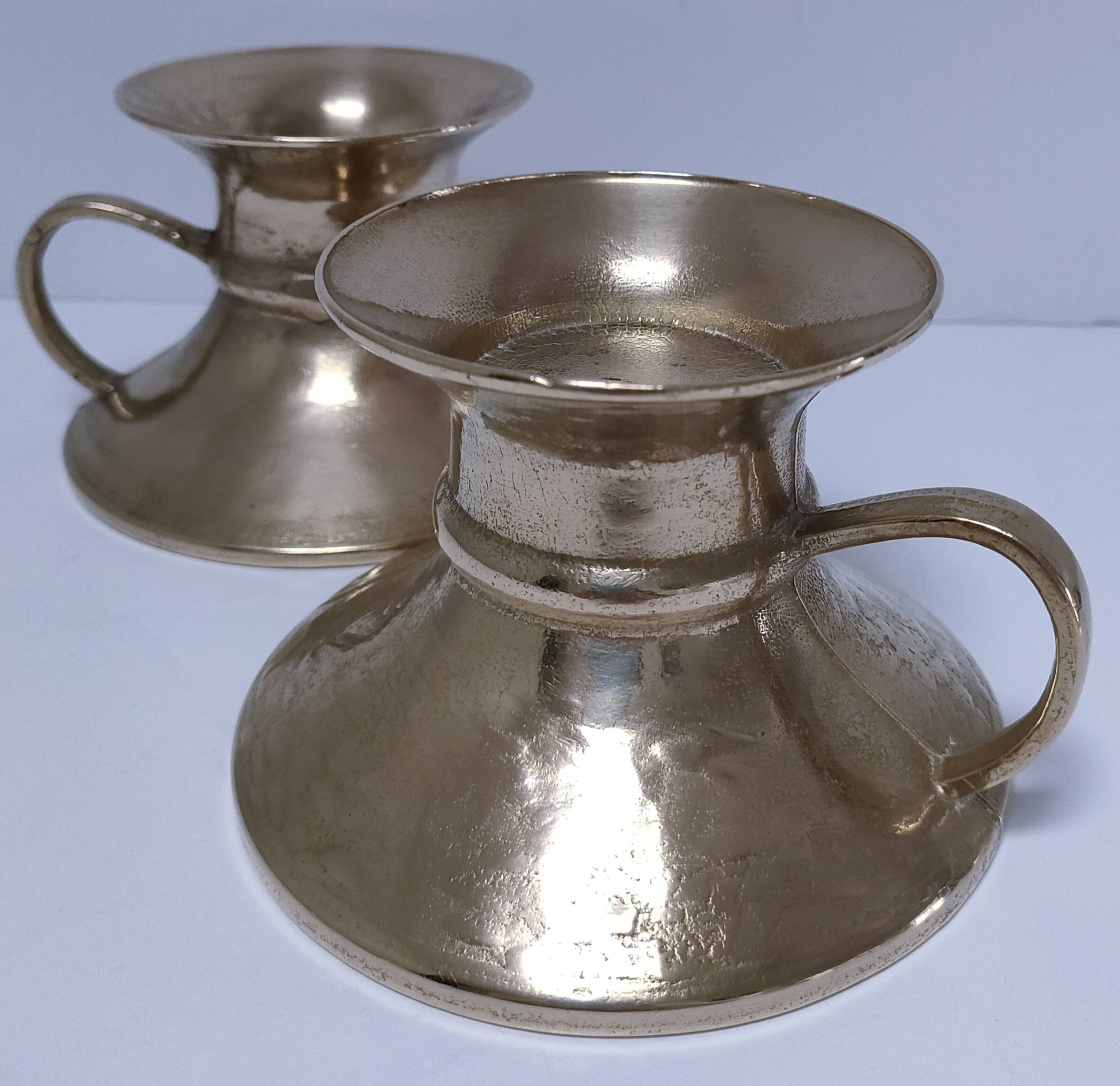 Pair of vintage solid brass hand candlesticks
