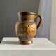 Speckled stoneware jug with grape pattern H17