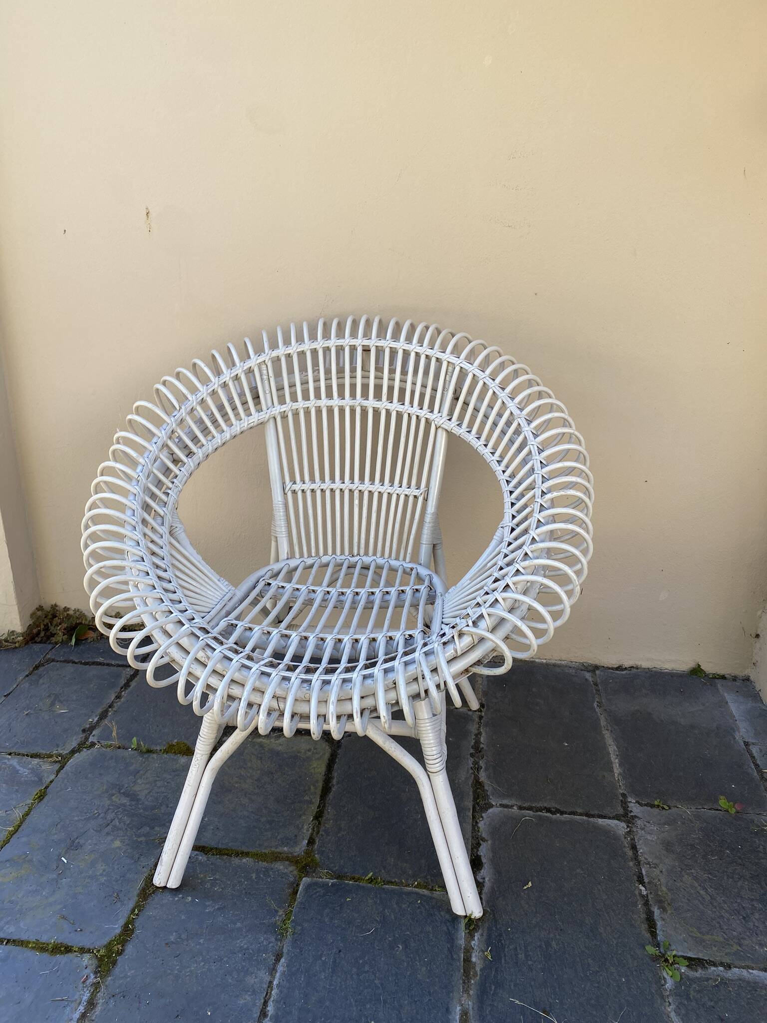 Vintage white rattan armchair
