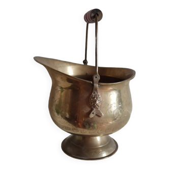 Chiseled brass bucket with lion heads