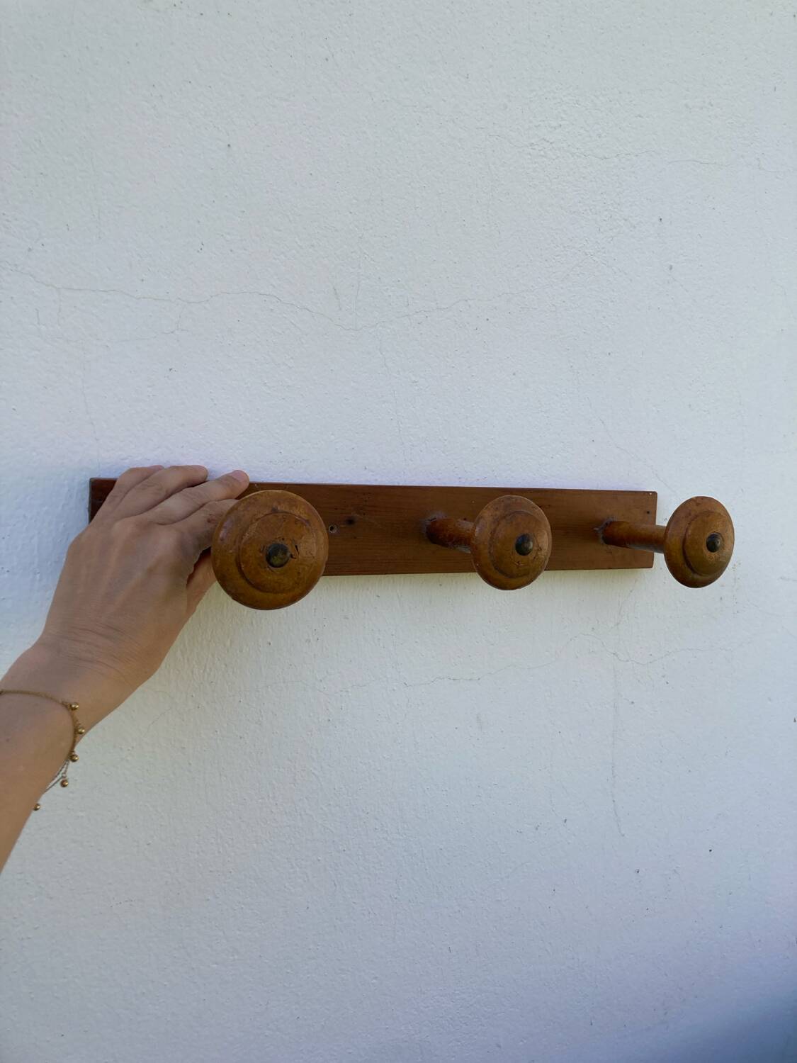 Old wooden wall coat rack