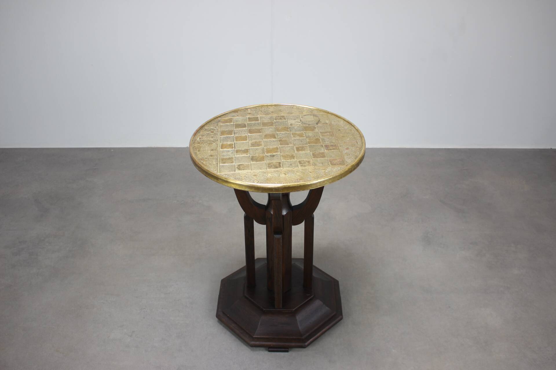 Art Deco chess table from the 1930s with a hand-decorated brass top and a stained oak base.