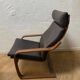 Leather armchair with footrest
