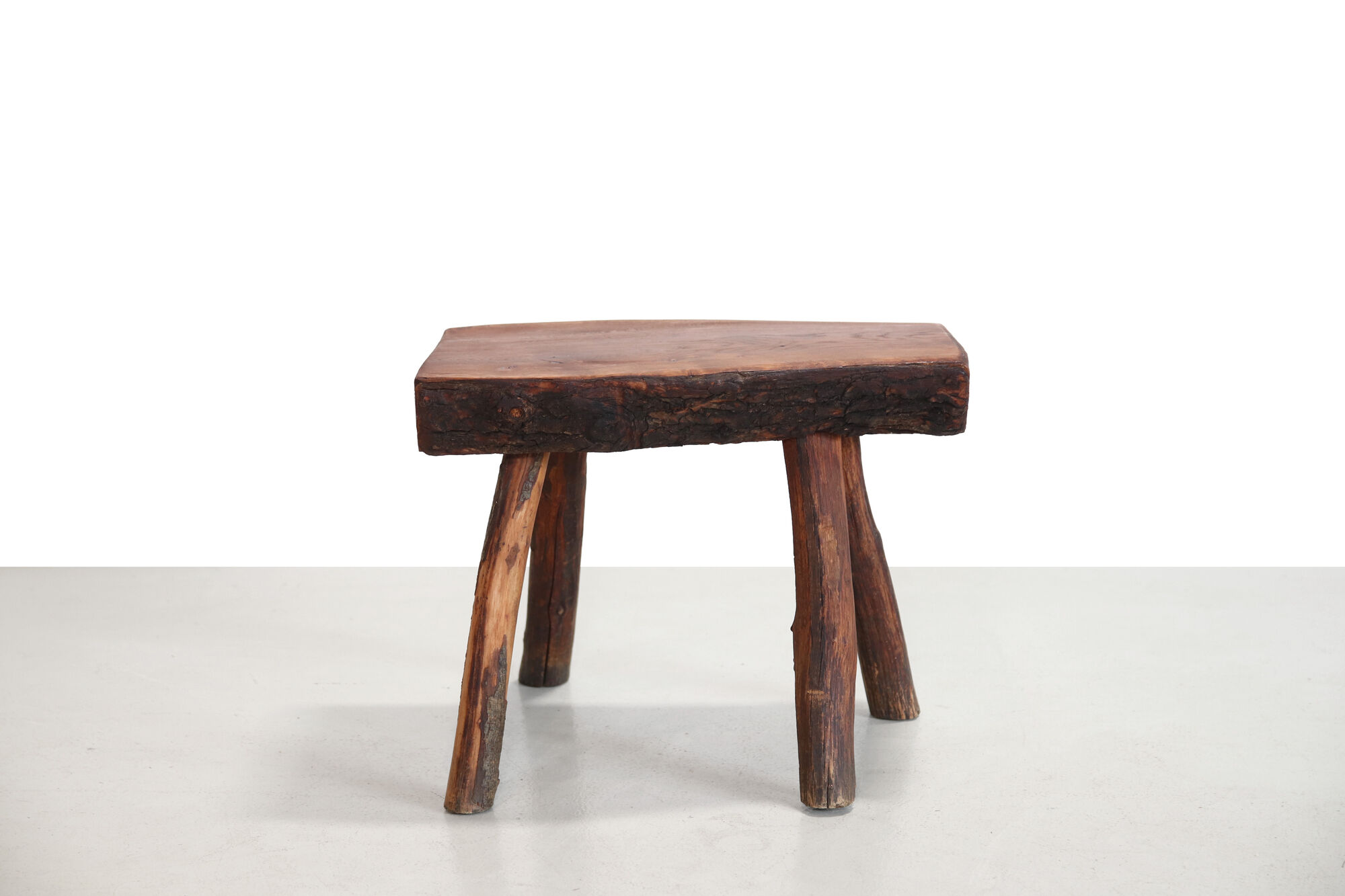 French brutalist tree trunk stools
