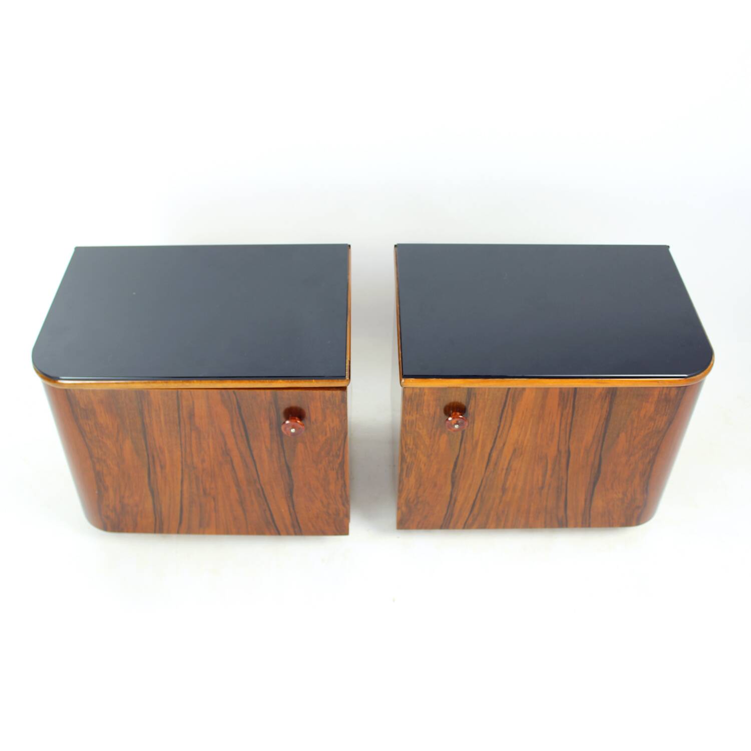 Pair of Art Deco bedside tables in walnut and black glass, Czechoslovakia.