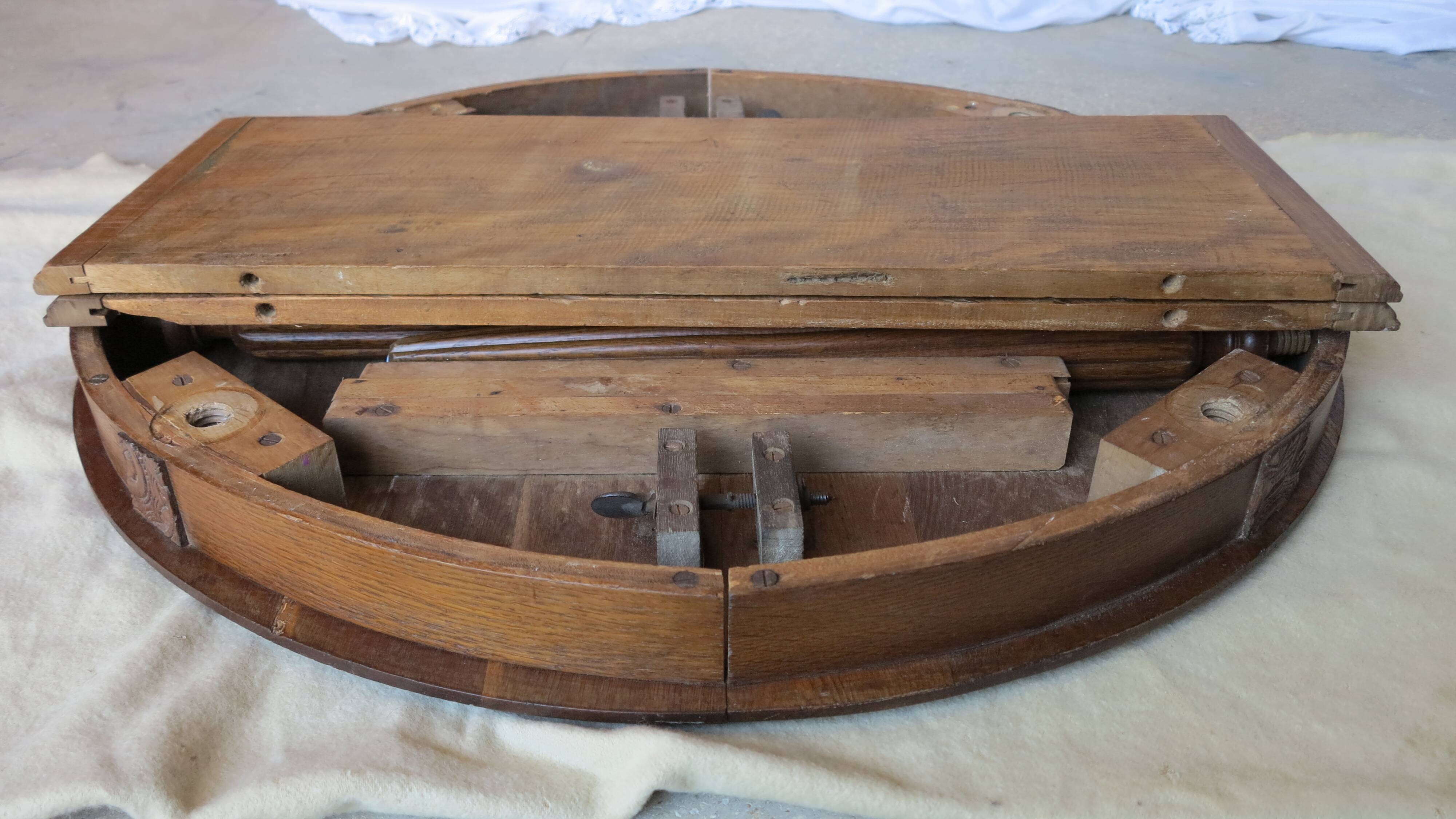 1930s oak dining table, slightly oval.