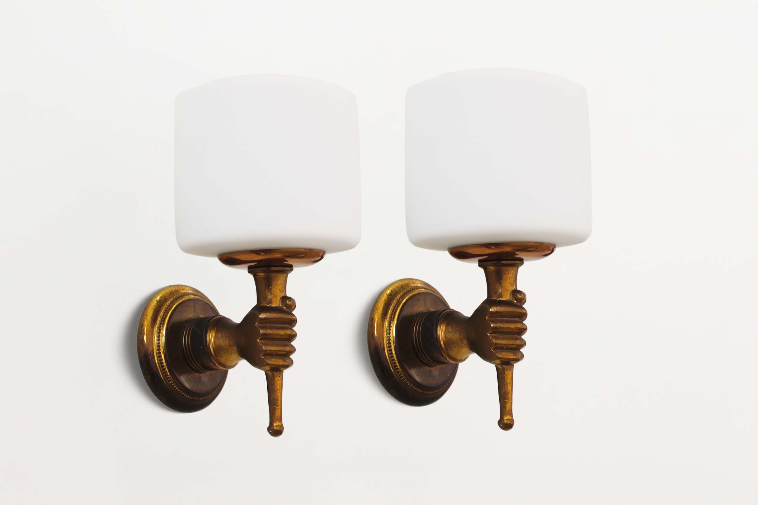 Pair of 1950’s solid brass ‘torch holding hand’ wall sconces by maison arlus