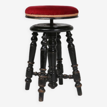 Attractive characteristic Art Deco piano stool in black lacquered wood with red velour upholstery, F