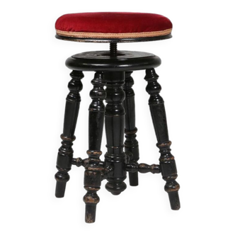 Attractive characteristic Art Deco piano stool in black lacquered wood with red velour upholstery, F