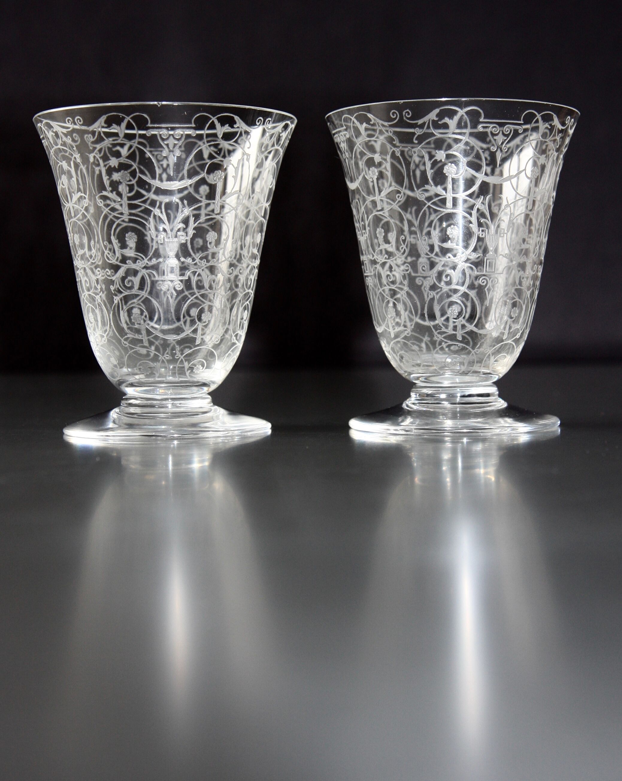 Two Baccarat glasses model "Michelangelo" in engraved crystal.
