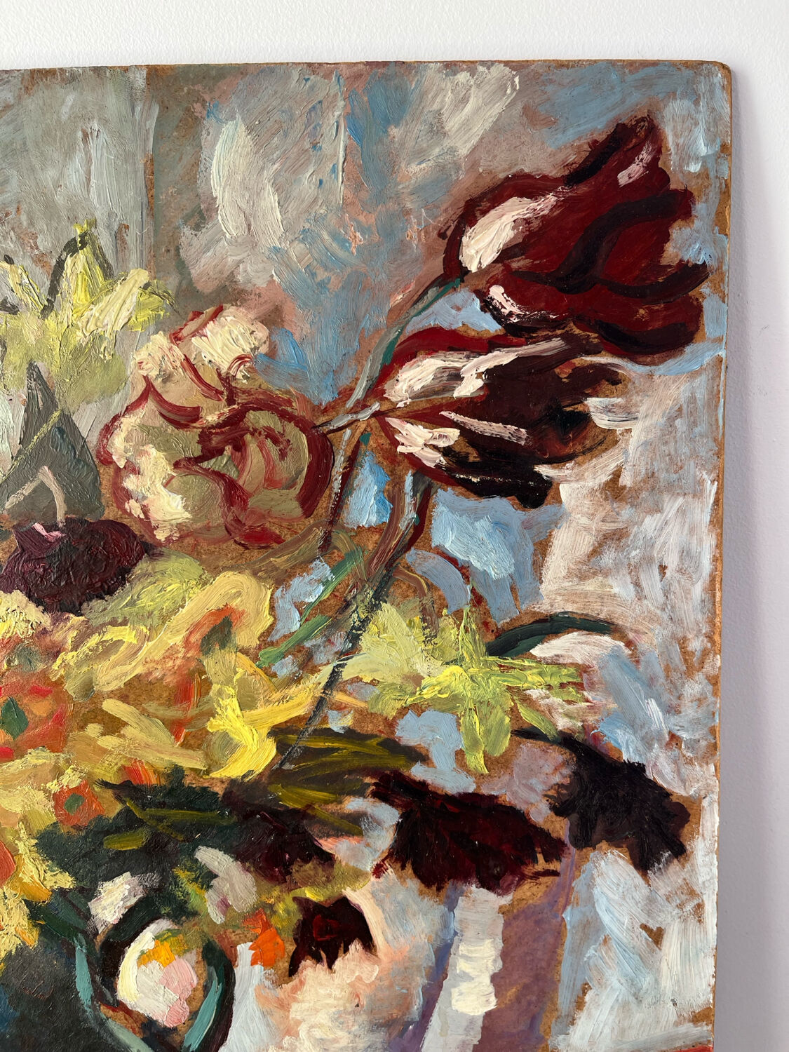 Bouquet of flowers on a red tablecloth, knife on a board, signed Renzo.