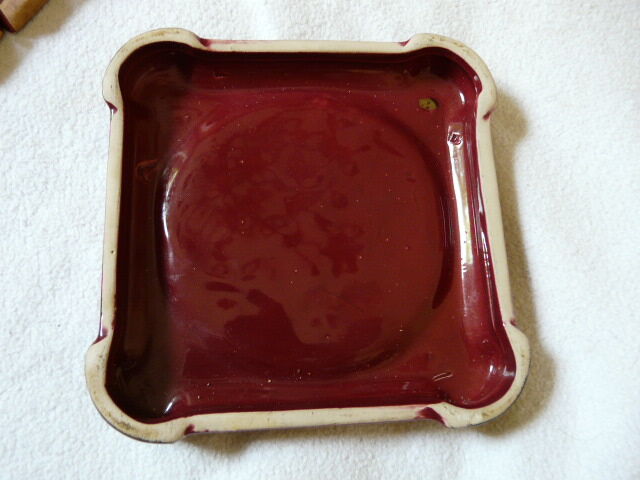 together 12 carries knives and a red enamelled earthenware bottle