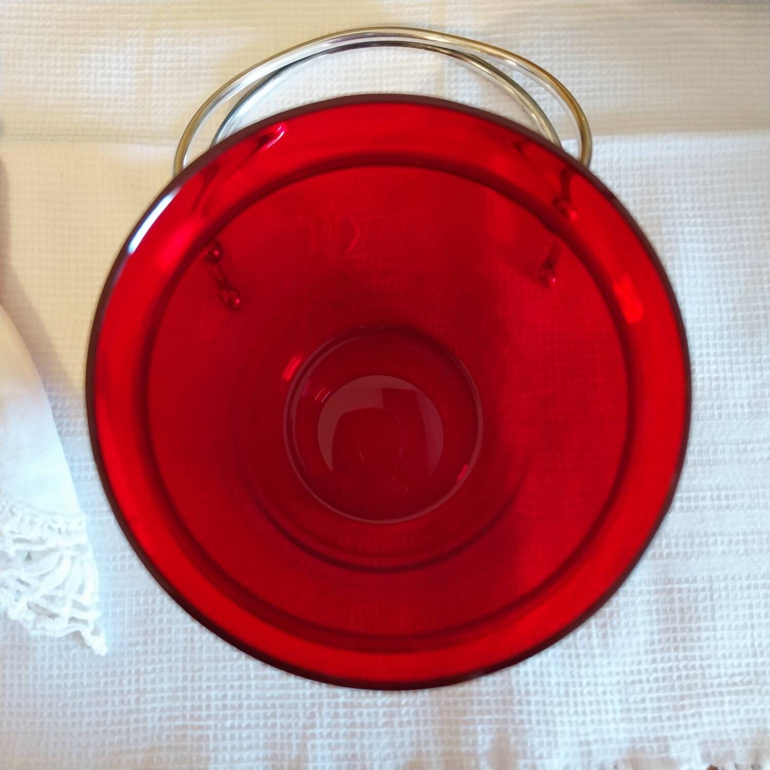 Vintage crystal ice bucket with silver-plated handle.