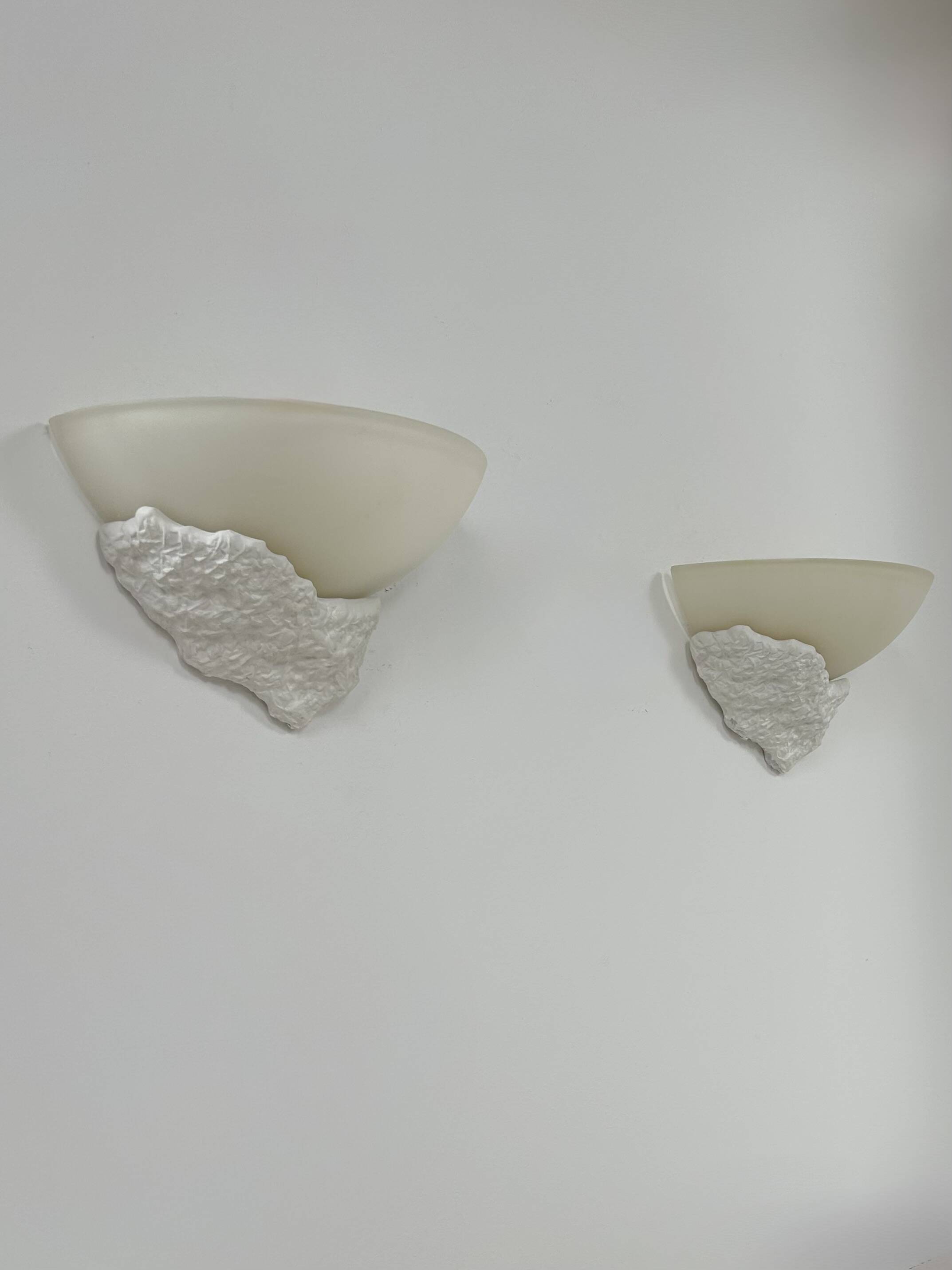 Pair of plaster and frosted glass wall lights, France, 1970.