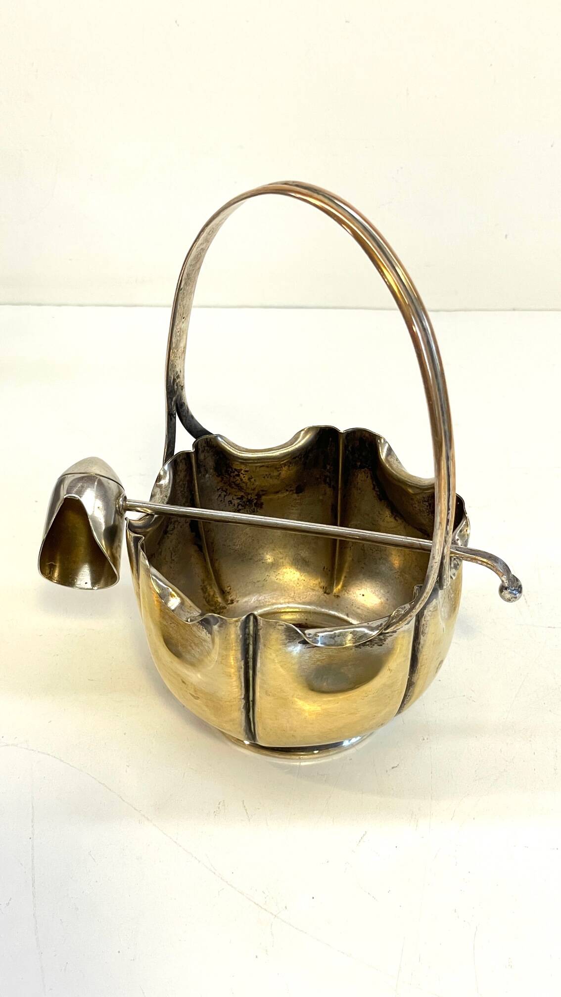 silver metal sugar bowl with gold patina