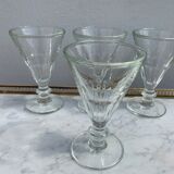 4 glasses of moulded pressed glass wine on foot