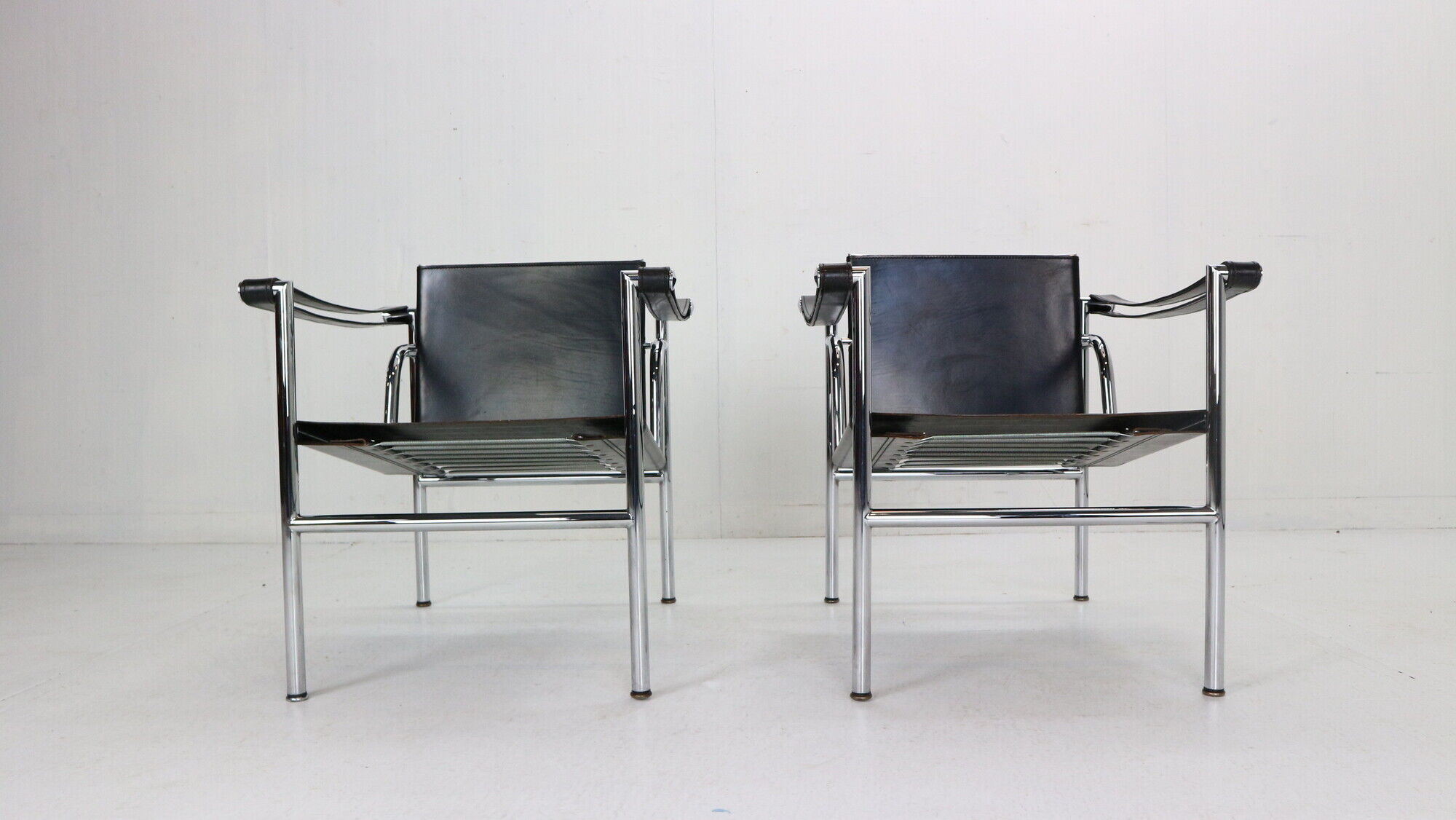 Le Corbusier Set of 2 Black Leather Armchairs Model- LC1 for Cassina, 1970s