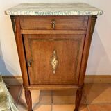 Antique bedside table in wood and marble – adorned with gilded brass ornaments –