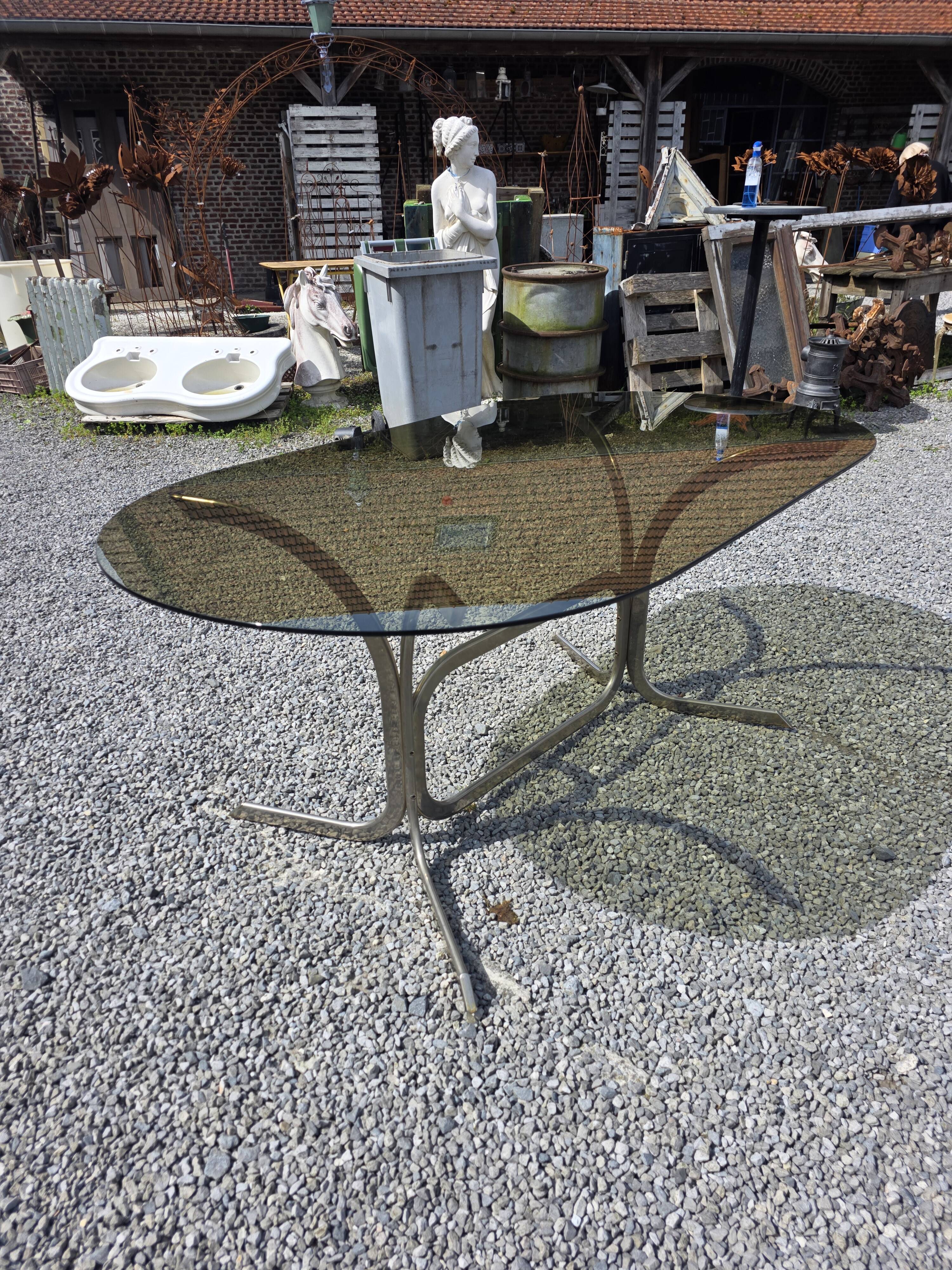 Silver metal table with smoked glass top from the 1970s.