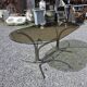 Silver metal table with smoked glass top from the 1970s.