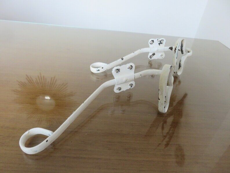 Pair of white metal hooks 30s 40s