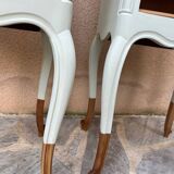 Renovated bedside tables in laurel green and light wood.