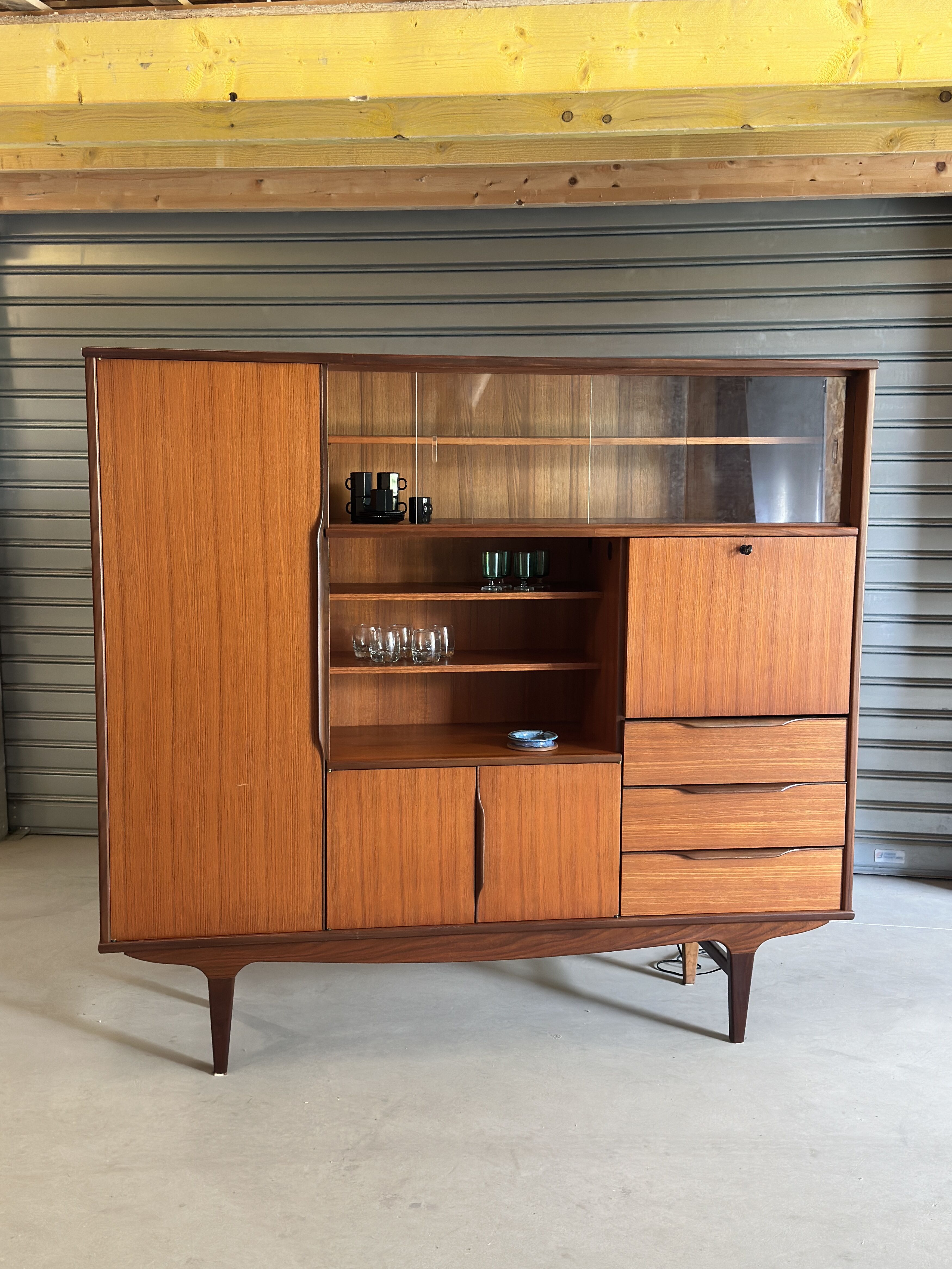 Very beautiful Scandinavian highboard in teak from the 1960s.