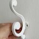 Set of 4 white lacquered metal hooks,