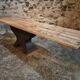 Old French industrial table with a cast iron base and a pine top.