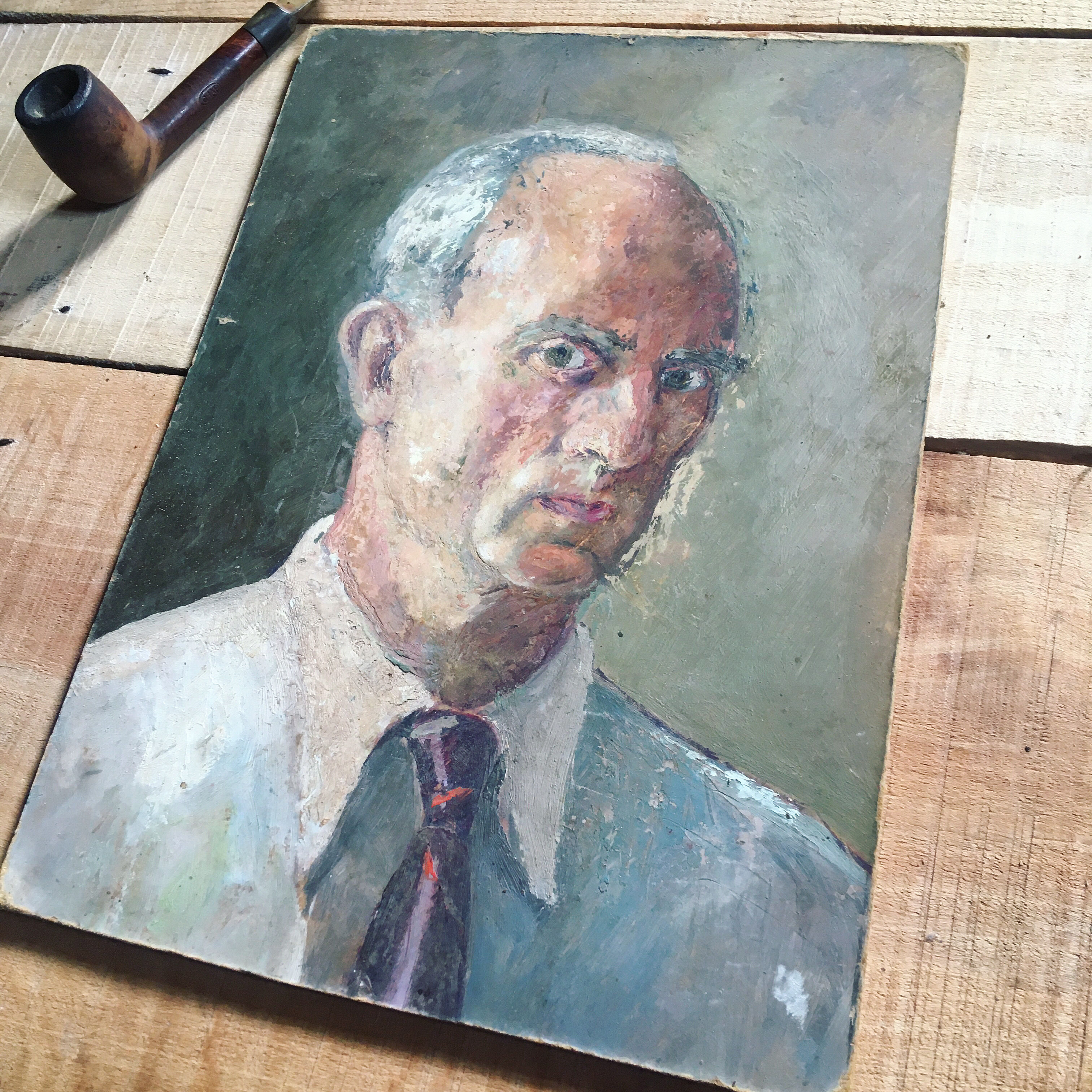 Portrait of a man with oil painting. Oil on Isorel. Oil painting. 1930s. Vintage portrait.